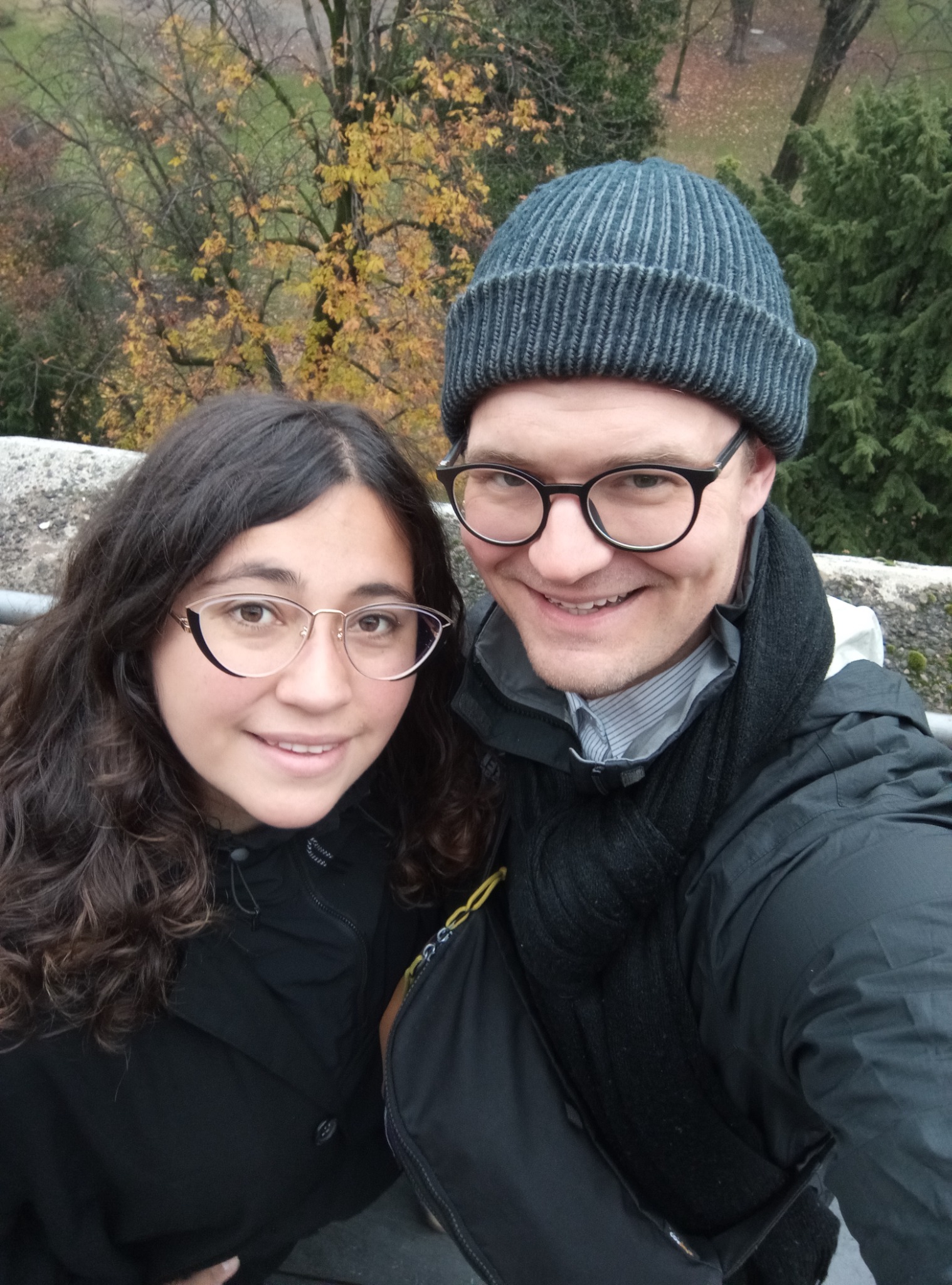 Tyler and Trini smiling together outdoors